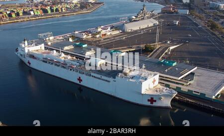 Los Angeles, USA. 28th Mar, 2020. The USNS Mercy (T-AH-19) sits at the Port of Los Angeles, Saturday, March 28, 2020, in San Pedro, Calif. The 1,000-bed Navy hospital ship was brought from San Diego to help take the load off Los Angeles area hospitals by treating non-coronavirus patients, who will have to undergo screening before being allowed on board. Credit: European Sports Photographic Agency/Alamy Live News Stock Photo