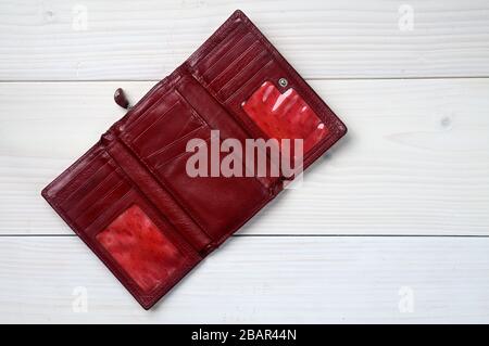 Brown leather purse on a white wooden background Stock Photo