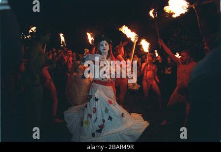 A woman dancer taking part in the Beltane Fire Festival which is held every year during the night of 30th April on Calton Hill in Edinburgh. An audience of around 15,000 people came to share the spectacular procession. Justifiably famous for its intensity and colour, the event became a much-loved feature of the Edinburgh calendar since it was first organised in the mid 1980s. Stock Photo