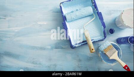 Interior renewal. Tray, roller and brush for painting Stock Photo