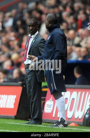 Charlton Athletic manager Chris Powell on the touchline with his assistant Alex Dyer (right) Stock Photo