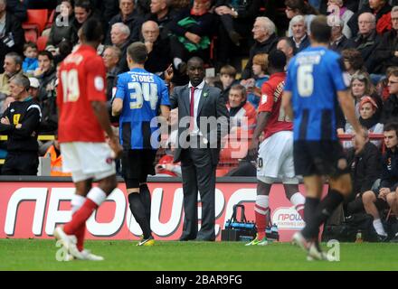 Charlton Athletic manager Chris Powell (centre) gives instruction from the touchline Stock Photo