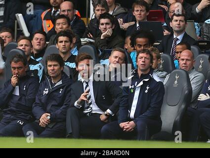 Tottenham Hotspur's goalkeeper Brad Friedel (right) sits on the bench near his manager Andre Villas-Boas (centre) Stock Photo