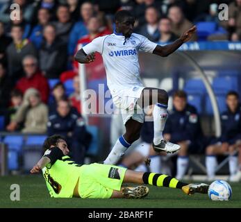 Tranmere Rovers' Zoumana Bakayogo hurdles the challenge from Yeovil Town's Ed Upson