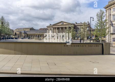 Deserted St Georges Square, and railway station, Huddersfield on Saturday morning 28th March 2020 during the lockdown due to the corono virus pandemic. Stock Photo
