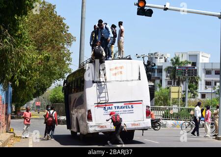Prayagraj, India. 29th Mar, 2020. Prayagraj: People travel on roof of a bus as they going to their native places during Nationwide Lockdown in wake of Corona Virus pandemic in Prayagraj (Allahabad) on Sunday, March 29, 2020. (Photo by Prabhat Kumar Verma/Pacific Press) Credit: Pacific Press Agency/Alamy Live News Stock Photo