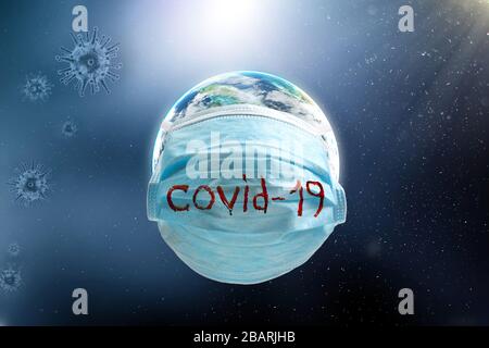 Blue Medical Disposable Face Mask with with a bloody inscription covid-19 put on a around globe. Epidemic Corona virus quarantine concept. Stock Photo