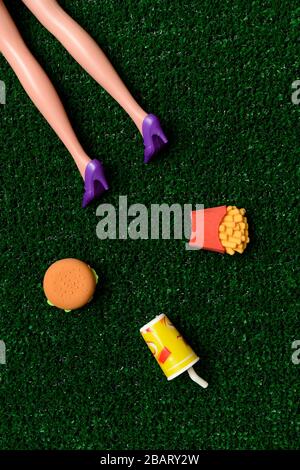 Body of woman on the ground near fast food Stock Photo