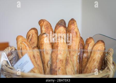 a group of baguette on a wood basket Stock Photo