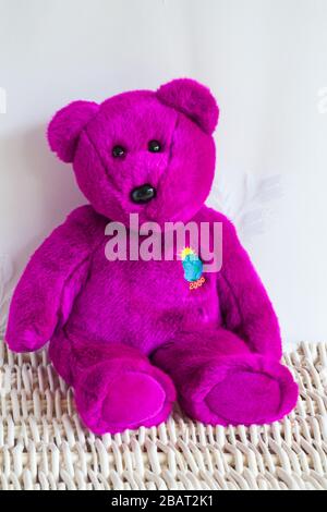 purple beanie baby with flower