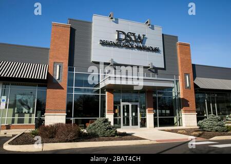 A logo sign outside of a Designer Shoe Warehouse (DSW) retail store location in North Wales, Pennsylvania, on March 23, 2020. Stock Photo