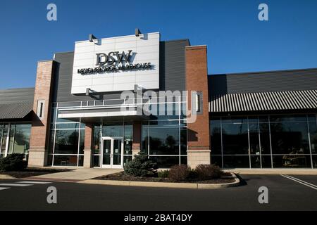 A logo sign outside of a Designer Shoe Warehouse (DSW) retail store location in North Wales, Pennsylvania, on March 23, 2020. Stock Photo