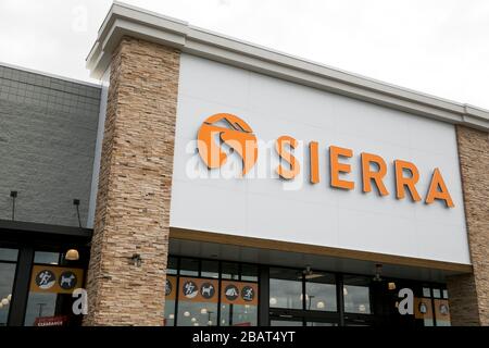 A logo sign outside of a Sierra retail store location in East Hanover, New Jersey, on March 23, 2020. Stock Photo