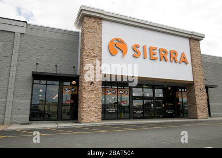 A logo sign outside of a Sierra retail store location in East Hanover, New Jersey, on March 23, 2020. Stock Photo