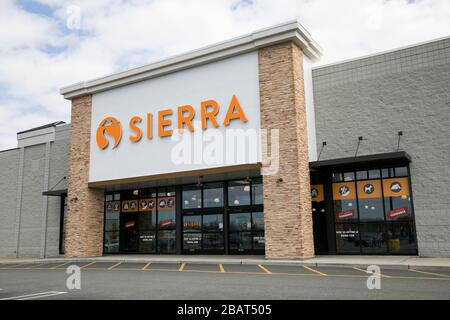 A logo sign outside of a Sierra retail store location in East Hanover, New Jersey, on March 23, 2020. Stock Photo