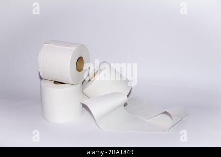 Three toilet paper rolls on white background with copy space Stock Photo