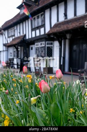 Historic half timbered Tudor pub called the Queen's Head, in Pinner High Street, Pinner Village, Middlesex, north west London, UK. Stock Photo
