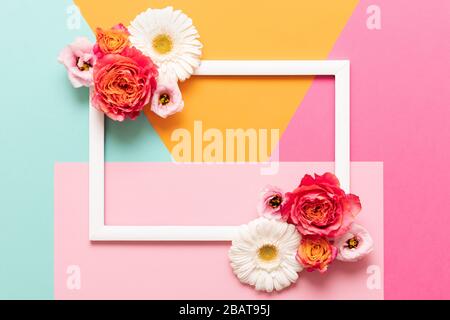 Happy Mother's Day, Women's Day, Valentine's Day or Birthday Pastel Colored Background.  Multicolored flat lay mock up greeting card with beautiful fl Stock Photo