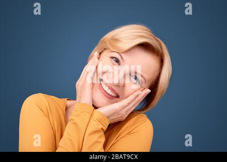 Middle aged woman smiling nice, looking at camera Stock Photo