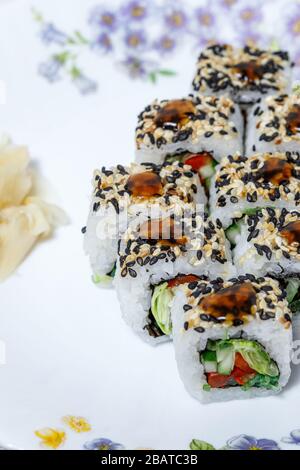 Sushi and rolls home delivery. Krpny plan. Sesame, salmon, cheese. Stock Photo