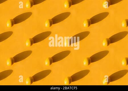 Fresh lemon pattern on a vivid yellow background Stock Photo