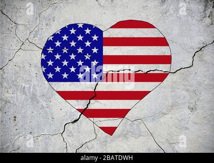 USA flag in the shape of a heart on an old flaccid wall. Stock Photo