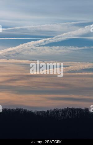 Contrails and clouds make interesting designs in the sky at the Tanbark Ridge Overlook on the Blue Ridge Parkway in Asheville, NC, USA. Stock Photo