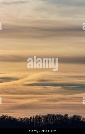 Contrails and clouds make interesting designs in the sky at the Tanbark Ridge Overlook on the Blue Ridge Parkway in Asheville, NC, USA. Stock Photo