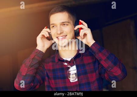 Workman at the sawmill. Young hardworking man Stock Photo