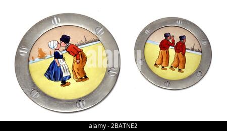 old porcelain and metal dishes, Dutch motifs. Stock Photo
