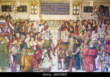 SIENA, ITALY - JULY 10, 2017: Frescoes (1502) in Piccolomini Library in Siena Cathedral, Tuscany, Italy, by Pinturicchio depicting a scene in the Life Stock Photo