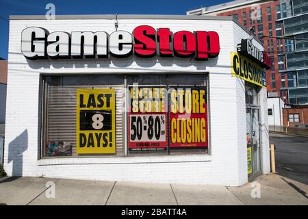 'Store Closing' signs outside of a GameStop retail store location in Wheaton, Maryland on March 26, 2020. Stock Photo
