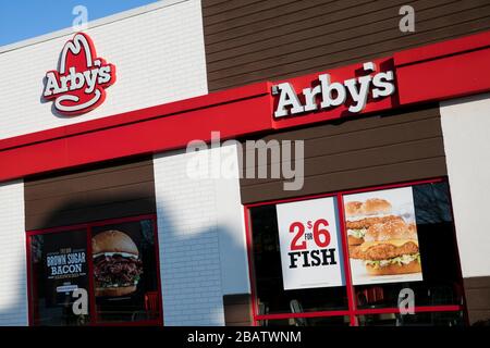 A logo sign outside of a Arby's restaurant location in Bel Air, Maryland on March 26, 2020. Stock Photo