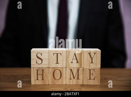 A message from a businessman to all workers to stay at home during the Coronavirus Pandemic Stock Photo