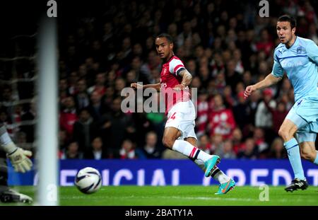 Arsenal's Theo Walcott scores his side's fourth goal of the game Stock Photo