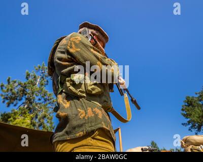 Reviving history actors of Slovenia Pivka museum of military history representing Russian Army soldier in Afganistan Stock Photo