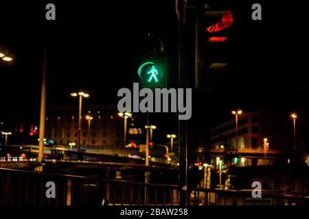 Closeup of colorful traffic lights with arrows in night city Stock Photo