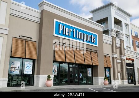 A logo sign outside of a Pier 1 Imports retail store location in Cockeysville, Maryland on March 26, 2020. Stock Photo