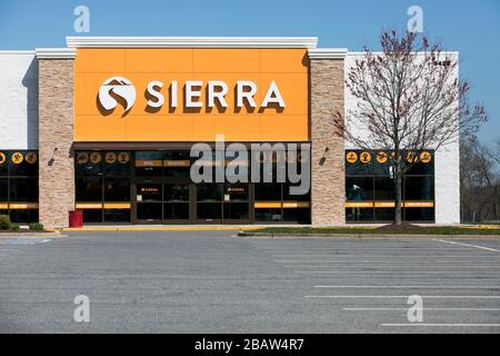 A logo sign outside of a Sierra retail store location in Frederick, Maryland on March 26, 2020. Stock Photo