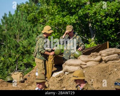 Reviving history actors of Slovenia Pivka museum of military history representing Russian Army soldiers in Afganistan Stock Photo