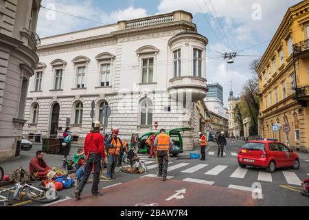 Zagreb, Gajeva street, volunteers resting on the streets after the cleaning damaged rooftops Stock Photo