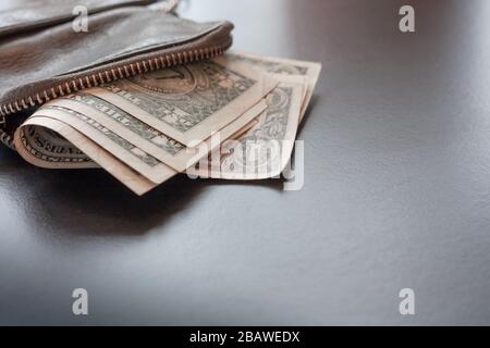 Dollar cash in leather wallet on black background, money concept. one dollar banknotes. Place for text Stock Photo