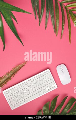 Keyboard and mouse on the pink background. Top view. Copy space Stock Photo