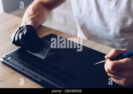 Technician installing new RAM module into the memory slot Stock Photo ...