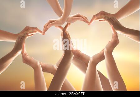 Diversity Love And Unity Partnership As Heart Hands In Groups Of Diverse  People Connected Together Shaped As An Inclusion And Inclusive Support  Symbol Of Teamwork And Togetherness. Stock Photo, Picture and Royalty