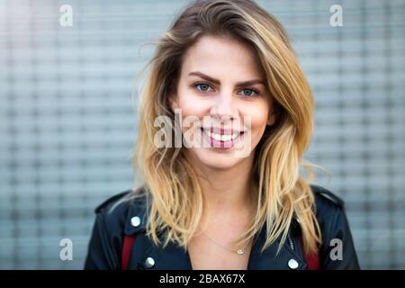 Portrait of a beautiful young woman at sunset Stock Photo