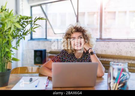 Portrait of young confident creative businesswoman in office Stock Photo
