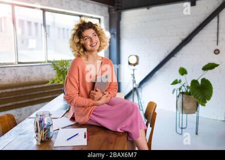 Portrait of young confident creative businesswoman in office Stock Photo