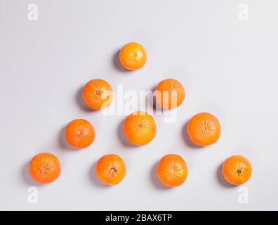 Three Fresh Oranges on Grey Background Stock Photo