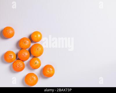 Three Fresh Oranges on Grey Background Stock Photo